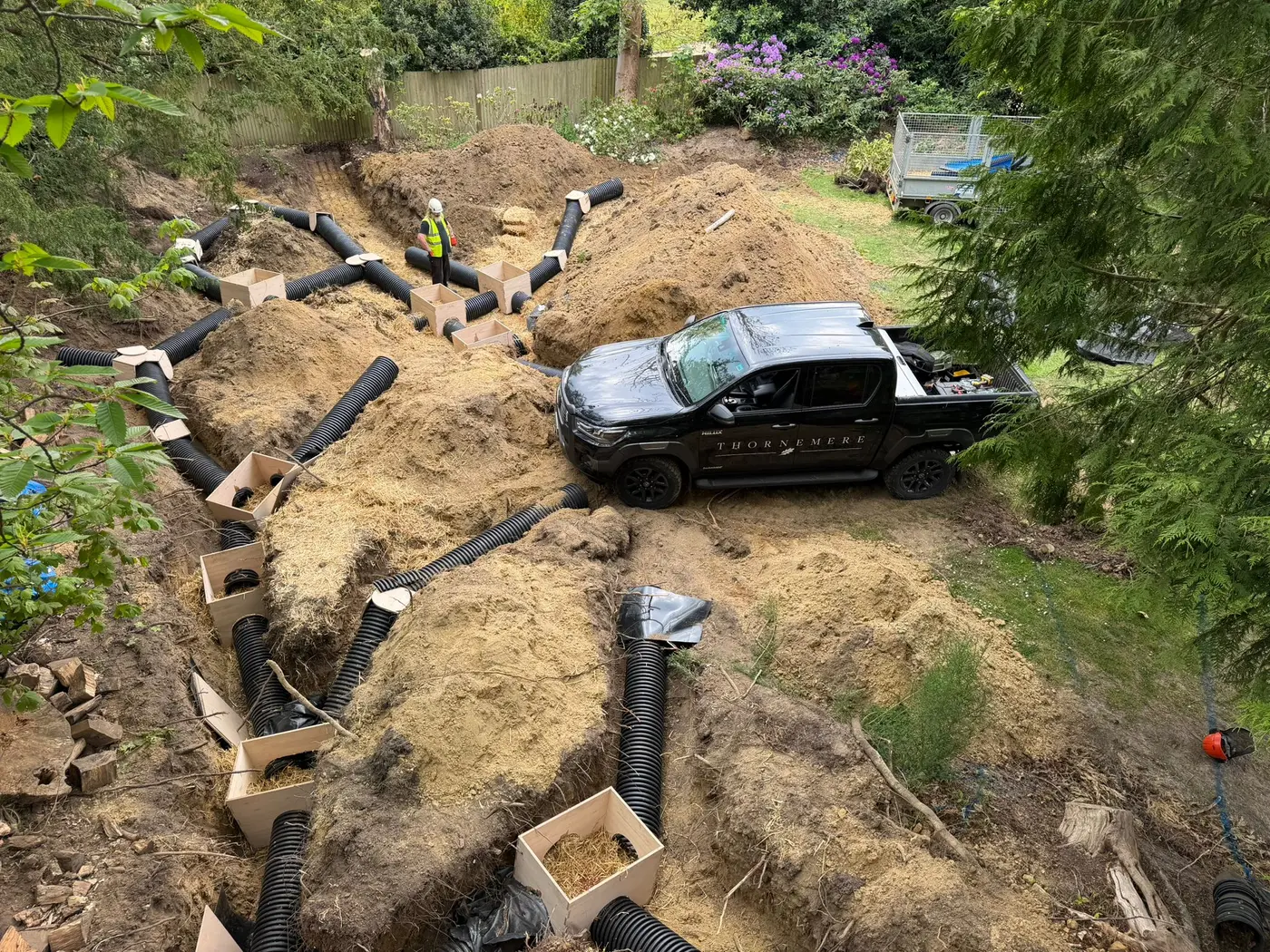 A completed artificial badger sett — chambered network of timber boxes and tunnels